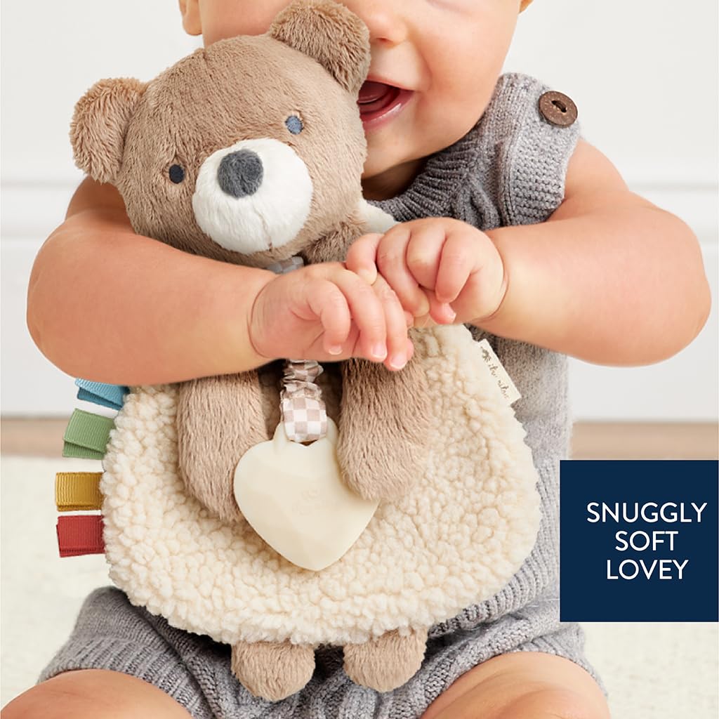 Itzy Ritzy - Itzy Lovey Including Teether - Baby Lovey with Teether, Textured Ribbons & Dangle Arms - Features Crinkle Sound, Sherpa Fabric and Minky Plush (Bear)