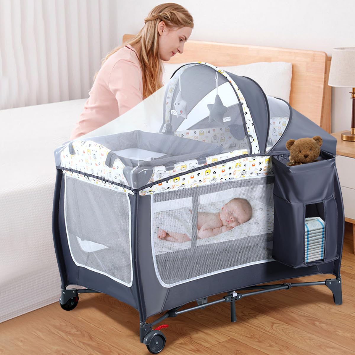 4 in 1 Pack and Play,Portable Nursery Center Baby Playard with Bassinet &Changing Table,Foldable Baby Crib Travel Playpen with Wheels,Removable Canopy with Toys,Storage Bag (Grey)