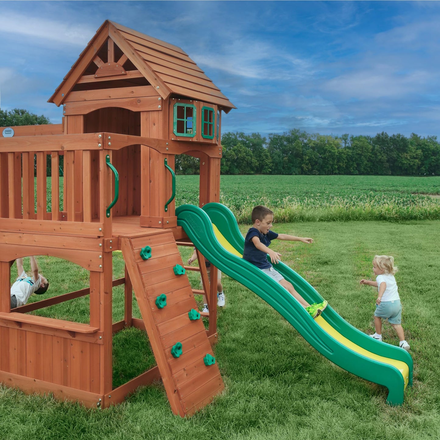 Backyard Discovery Atlantis Cedar Wood Swing Set with Wave Slide, Raised Clubhouse, Rock Wall, Belt Swings, Trapeze, Balcony, Lower Play Space, Snack Bar, Sandbox Area, Step Ladder, Outdoor Playset